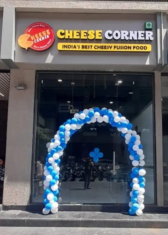 Cheese Corner outlet grand opening with balloon arch